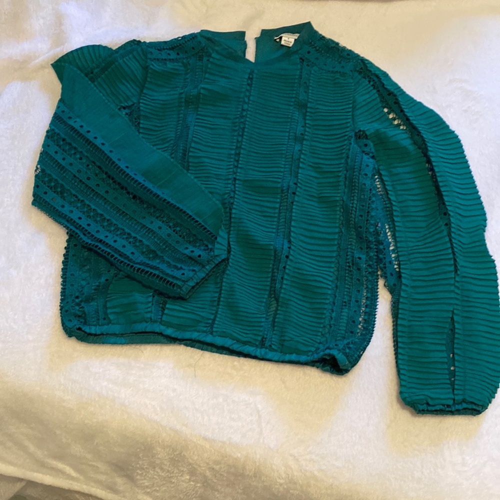 Unique style and color top, very stylish.